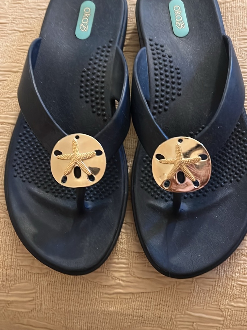 OKA B. Navy Flip Flops with Gold Starfish Medallions